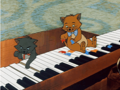 An animated GIF from Disney's The Aristocats, of two kittens playing on a piano.