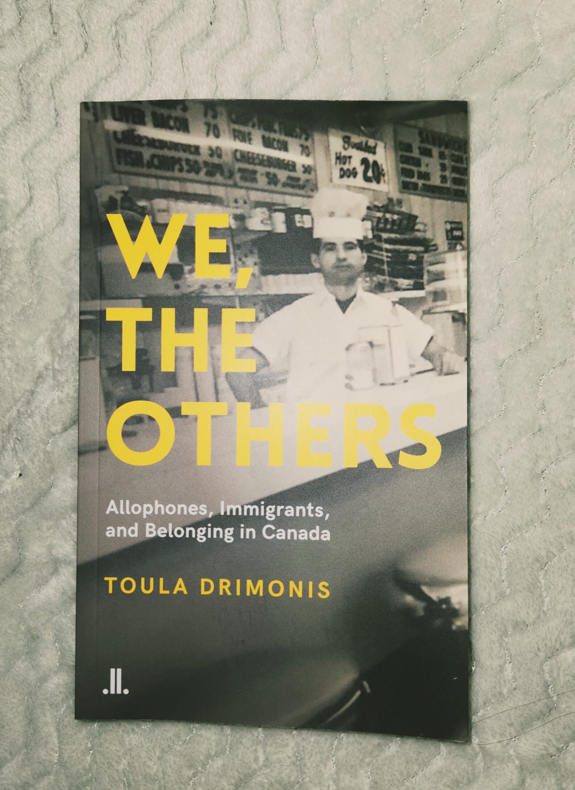 A copy of the book We, the Others by Toula Drimonis.