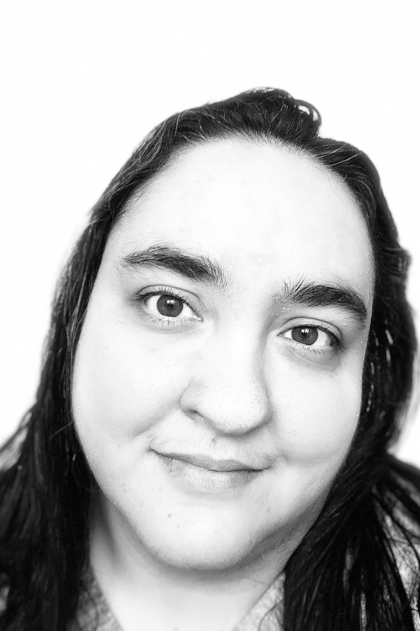 A black and white photo of writer Sonia Sulaiman, a woman with long dark hair.